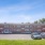 a parking lot with cars and a building in the background