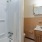 a bathroom with a tub sink and toilet