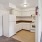 a kitchen with white cabinets