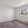 a room with a carpet and a window